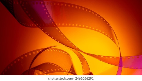 multi-colored background with real movie tape. cinema background for film production, film festivals, premieres, ticket announcements, flyers. - Powered by Shutterstock