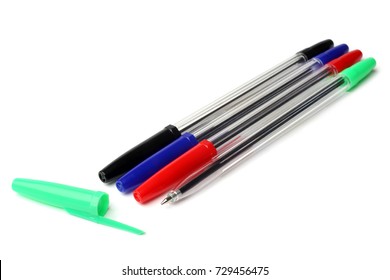 Multicolored ball pens on white background