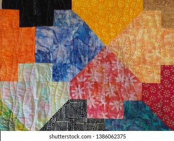 Multicolored Batik Fabric Patchwork Quilt With Machine Quilting And Tessellation Pattern