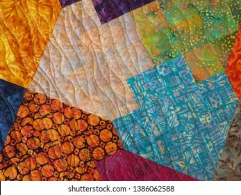 Multicolored Batik Fabric Patchwork Quilt With Machine Quilting And Tessellation Pattern