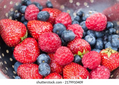 Multicolored Berries In Colander Closeup Selective Focus