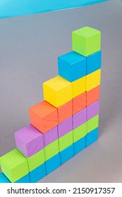 Multicolored Blocks Stacked Vertically On A Table