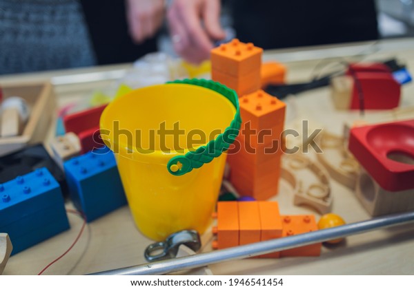 Multi-colored blocks of a wooden\
constructor. Concept of development of preschool children.\
Close.