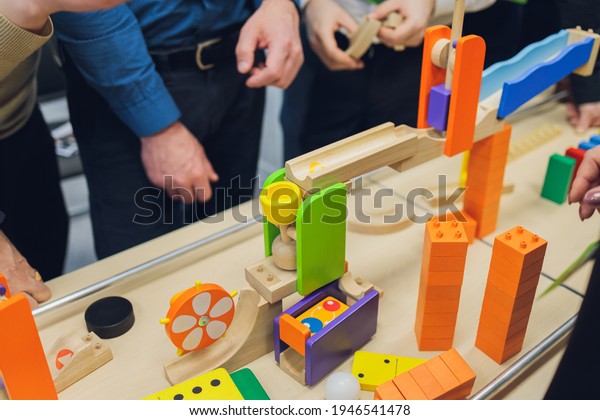 Multi-colored blocks of a wooden
constructor. Concept of development of preschool children.
Close.