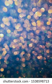 Multi-colored Bokeh. Colorful Beautiful Blurred Bokeh Background With Copy Space. Festive Texture. Glitter Multicolored Light Spots, Putting Up. Holiday Lights Bokeh Background. 