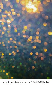 Multi-colored Bokeh. Colorful Beautiful Blurred Bokeh Background With Copy Space. Festive Texture. Glitter Multicolored Light Spots, Putting Up. Holiday Lights Bokeh Background. 