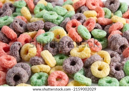 Multicolored breakfast cereal texture. Healthy and tasty fruit flavored cereal