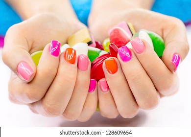 Multicolored And Bright Manicure On Female Hands