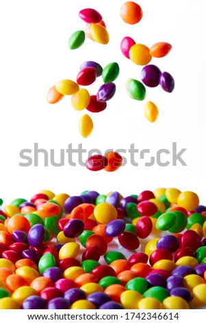 Multicolored candies for use as background. Selective focus