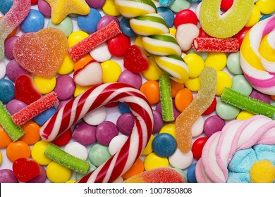 Multicolored candy and lollipops on a white background. - Powered by Shutterstock