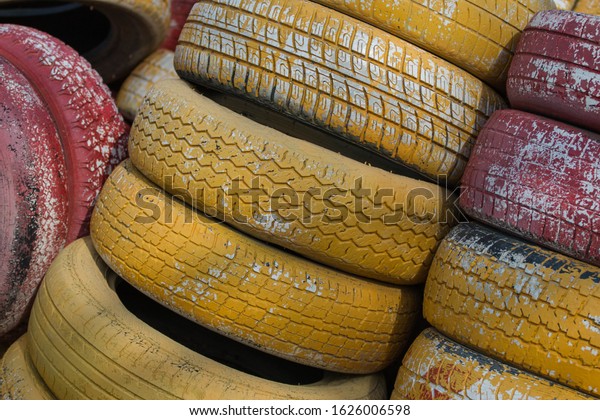 \
Multi-colored car tires, tire\
dump