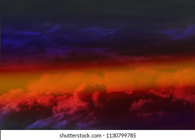 Multicolored clouds in front of a thunderstorm against the beautiful sky.