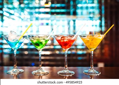 Multicolored cocktails at the bar. - Shutterstock ID 495854923