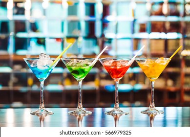 Multicolored cocktails at the bar. - Shutterstock ID 566979325