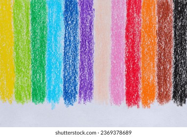 Multicolored crayon on paper drawing background. Colored crayon background rainbow. Wax crayon hand drawing on paper.