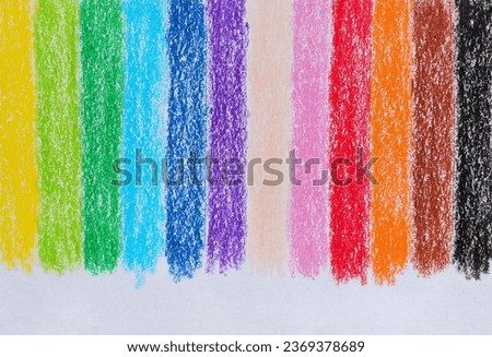 Multicolored crayon on paper drawing background. Colored crayon background rainbow. Wax crayon hand drawing on paper.