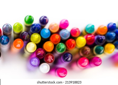 Multicolored crayons on a white background.