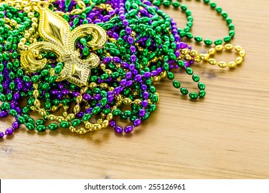 Multicolored Decorations For Mardi Gras Party On The Table.