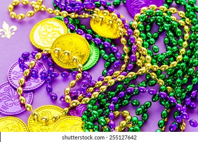 Multicolored Decorations For Mardi Gras Party On The Table.