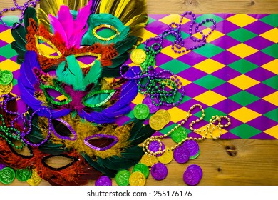 Multicolored Decorations For Mardi Gras Party On The Table.