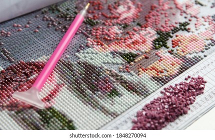 Multicolored Diamond Strases and Manual Fixer for handmade process of creation of diamond painting 3d from square rhinestones - Shutterstock ID 1848270094