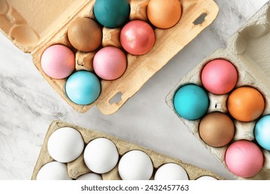 Multi-colored Easter chicken eggs lie on table. close-up, flat lay. top view, 90 degrees. minimalism, Easter decor, Easter card, postcard. Concept of preparation for holiday, Easter holiday
