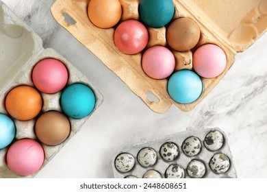 Multi-colored Easter chicken eggs lie on table. close-up, flat lay. top view, 90 degrees. minimalism, Easter decor, Easter card, postcard. Concept of preparation for holiday, Easter holiday
