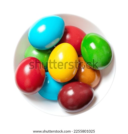 Multicolored Easter eggs in a white bowl. Group of rainbow colored Paschal eggs. Colorful dyed, hard boiled chicken eggs, traditionally used during Eastertide, to celebrate the resurrection of Jesus.
