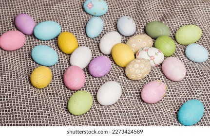 Multicolored Easter eggs in a wicker basket. Pastel colors of Easter eggs, background. - Shutterstock ID 2273424589