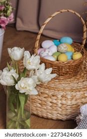 Multicolored Easter eggs in a wicker basket. Pastel colors of Easter eggs, background. - Shutterstock ID 2273424605