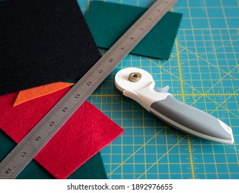 Multicolored Felts, A Rotary Cutter And A Ruler On The Cutting Mat. Sewing Tools And Materials. Preparing To A Handwork Process