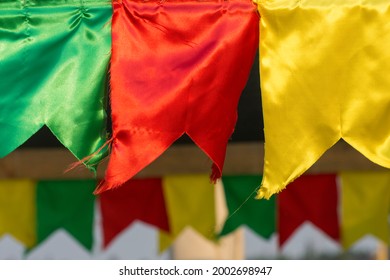 Multicolored flags made of fabric. Decoration for festivals and celebrations. Tibetan flags blowing in the wind, in the Himalayas, Nepal