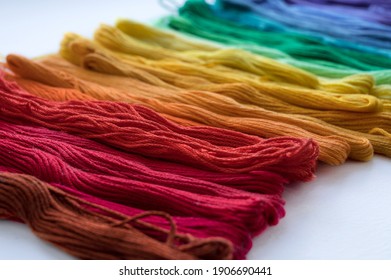Multicolored floss threads for embroidery  Rainbow gradient  Close  up 