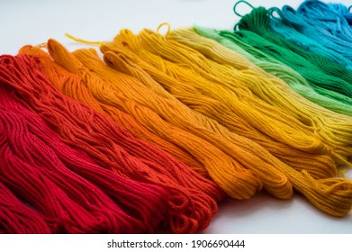 Multicolored floss threads for embroidery  Rainbow gradient  Close  up 