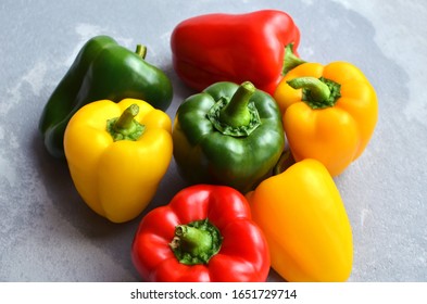 Multi-colored fresh bell peppers. Green, red and yellow vegetables. Organic healthy food concept.