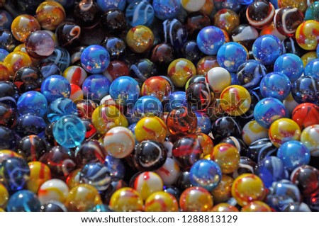 Multicolored glass marbles, background.