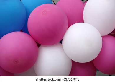 Multicolored inflatable balls as background. Abstract holiday celebration concept. Pink, blue and white balloons. - Shutterstock ID 637267948