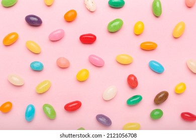 Multicolored jelly beans on color background - Powered by Shutterstock