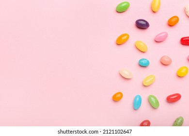 Multicolored jelly beans on color background - Powered by Shutterstock