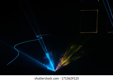 Multi-colored laser beams in abstract patterns on a laser show
