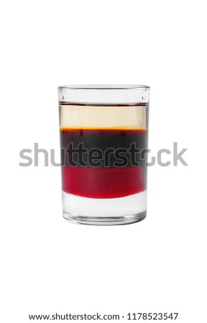 Multicolored layered cocktail, glass with transparent and colored drink, with the taste of coffee, berries, cherries, lemon, alcoholic, side view isolated white background
