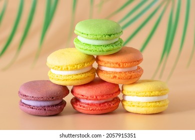 multicolored macaroons are stacked in a pyramid