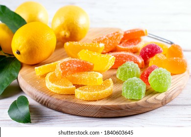 Multi-colored marmalade jelly candy's. Dessert marmalade in the form of lemon and orange slices. The sweetness of jelly candy yellow and orange.