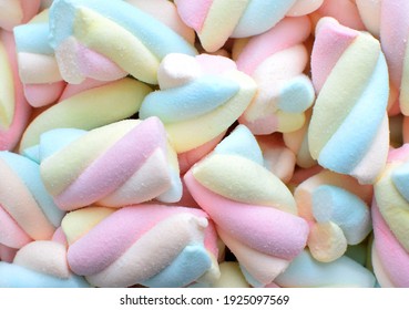 Multi-colored marshmallows. Background or texture of colorful blue and pink marshmallows. 