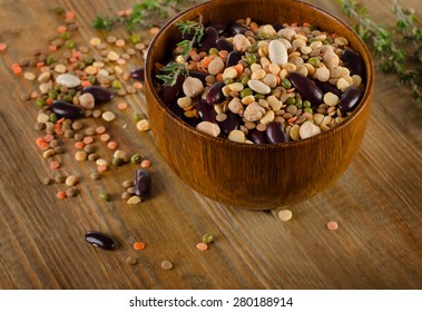 Multicolored Mixed Beans, Chickpeas  And Lentils On A Rustic  Wooden Table