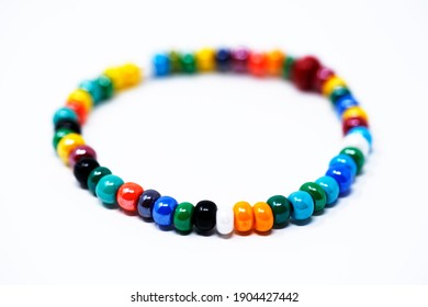 A multicolored Murano glass bracelet on a white background shallow depth of field. Made in Italy Venice.              