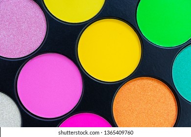 Multicolored Neon Eyeshadow Palette. Make-up. Beauty Products. Bright Colorful Beautiful Background. Tool For Makeup Artist. Cosmetic. Visagiste. Beauty Shop. Summer Eye Shadow. Yellow, Pink, Green.