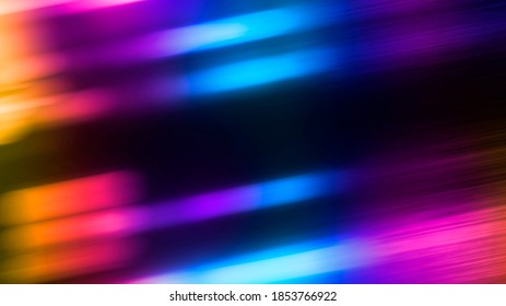 Multi-colored neon lights on a dark city street, reflection of neon light in puddles and water. Abstract night background, blurred bokeh light. Night view. - Shutterstock ID 1853766922