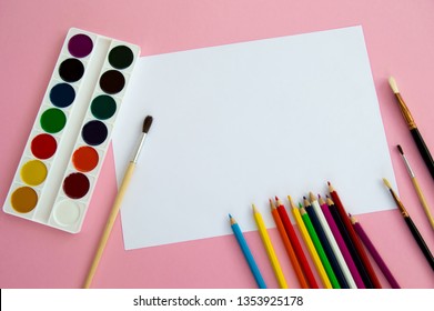 Multi-colored objects for drawing and creativity for children lie on a pink background. Bright watercolor paints, pencils, brushes and markers are on the table. A set for the artist to draw. - Shutterstock ID 1353925178