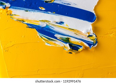 Multicolored oil paint on a palette - Shutterstock ID 1192991476